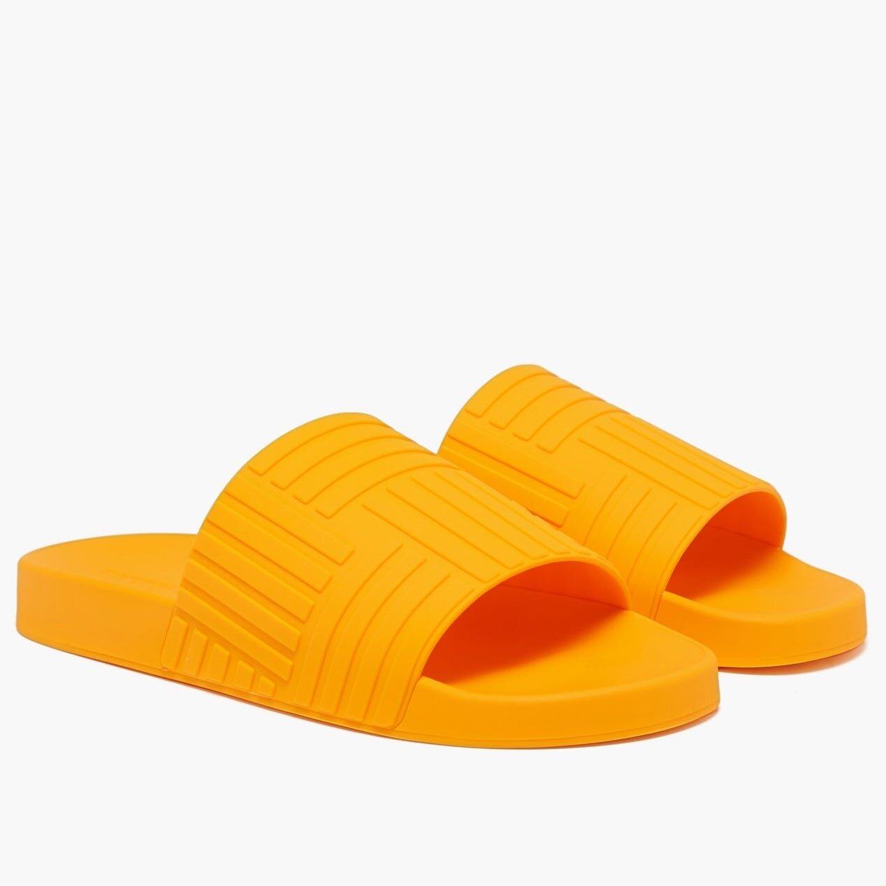 BOTTEGA VENETA Intrecciato-embossed rubber slides BOTTEGA VENETA Intrecciato-embossed rubber slides
